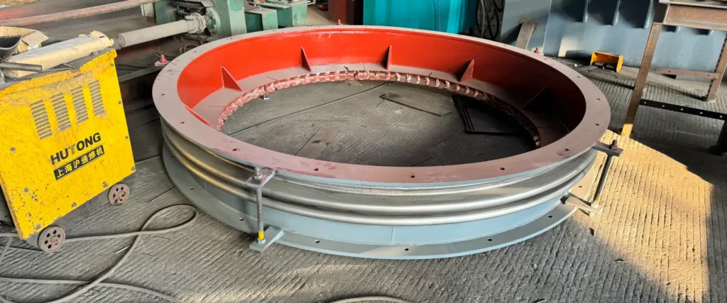 metal expansion joint failure showing bellows cracks and deformation