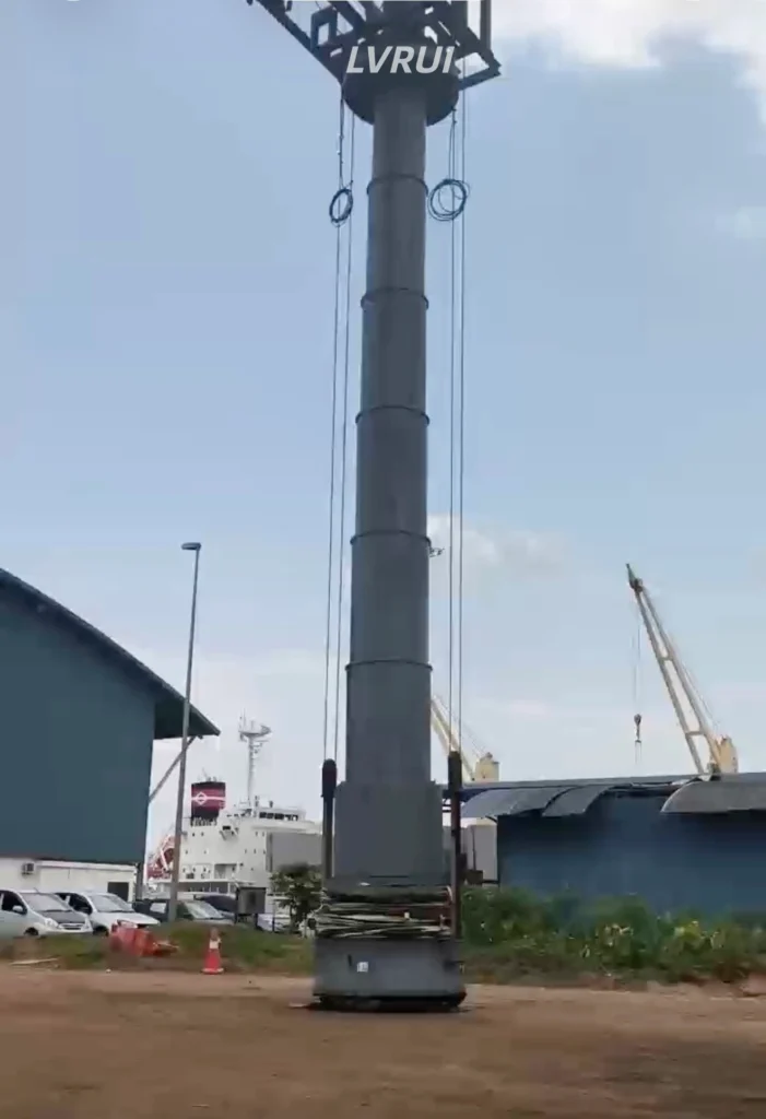 Full-height telescopic ship loading spout with lifting cables at a port in Malaysia