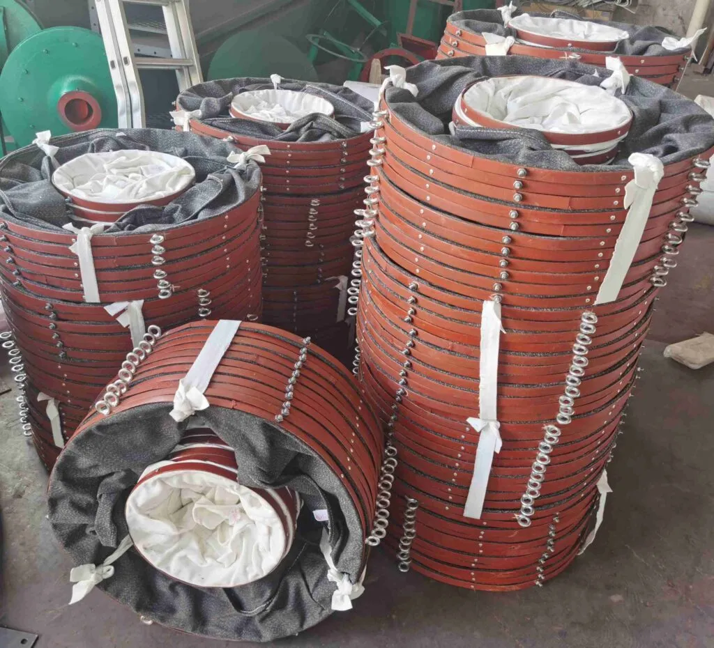 Canvas shrouds stacked, showing flexible dust-proof connectors for industrial conveyors